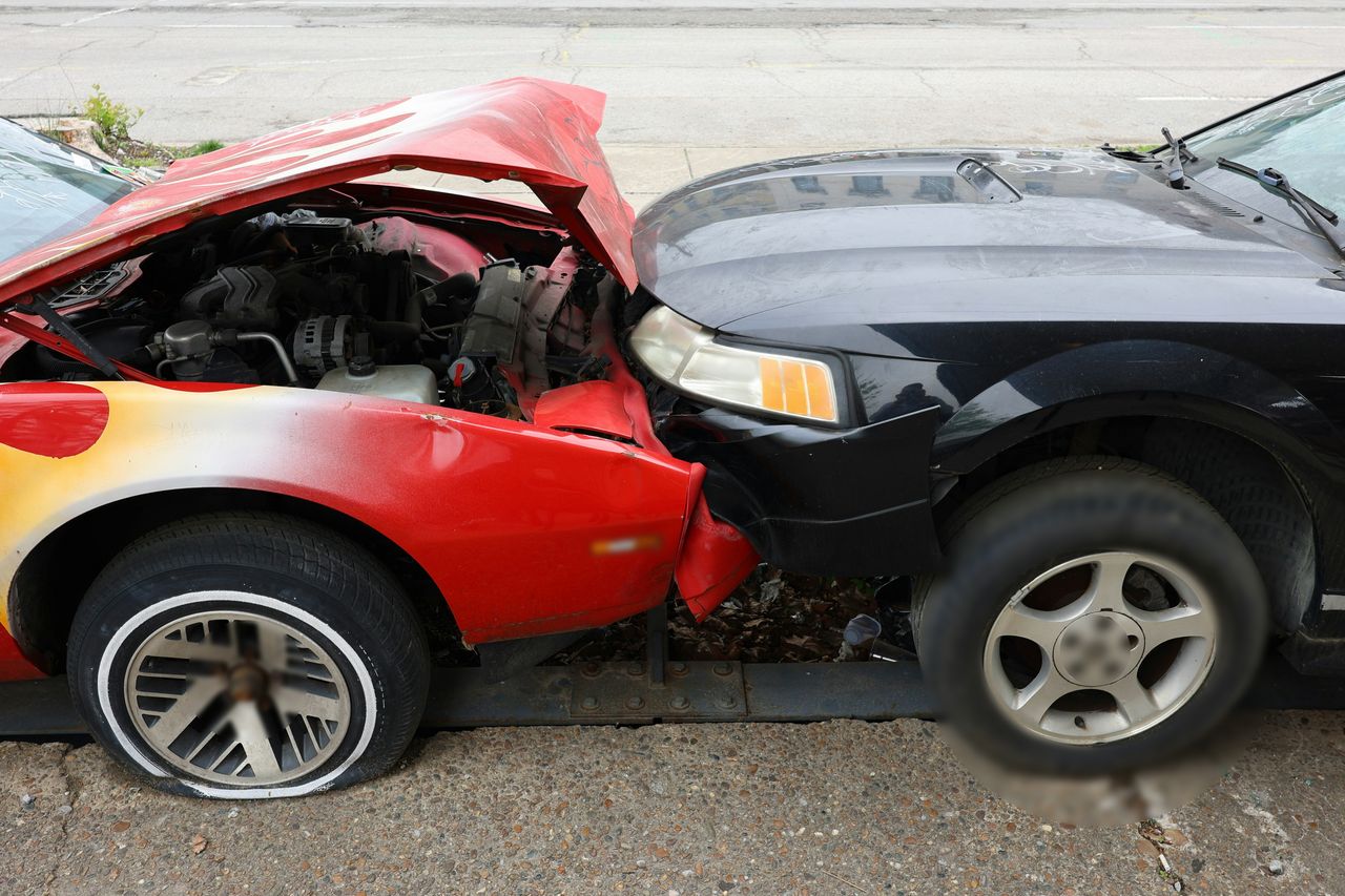 Two cars with front-end damage after a collision